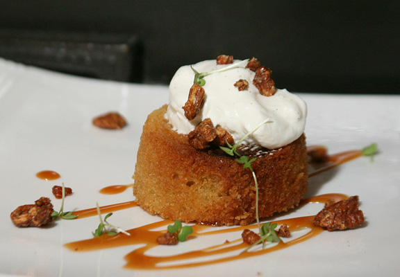 ‘Deleyda’ Olive Oil Cake made with ‘Nielsen Massey’ Madagascar Vanilla Powder & Beans along with ‘Green & Blacks’ Organic Milk Chocolate Toffee Bars Served with Dave’s Ooey Gooey Caramel Sauce, Candied Pecans & Sweet Cream