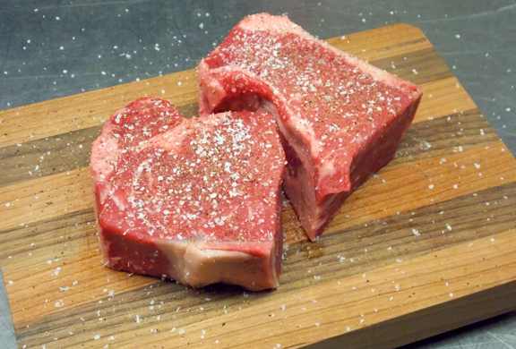 Brush steak with oil and season with salt and pepper