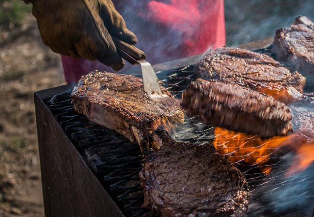 Outdoor grilling steaks