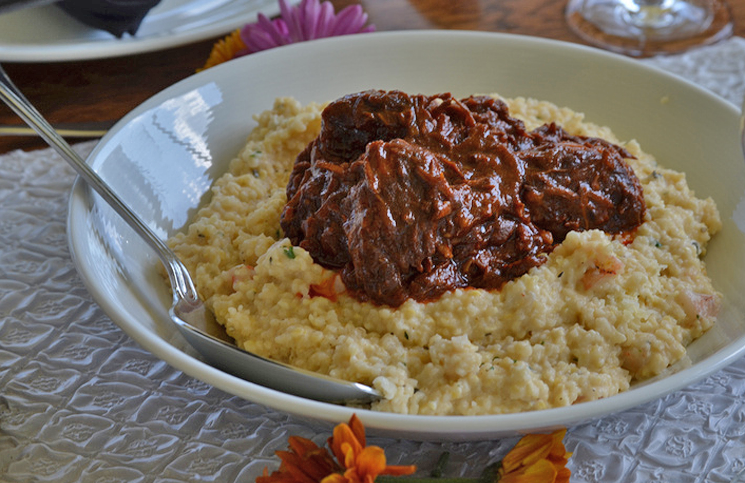 Braised Certified Angus Beef brand short ribs with cheesy shrimp grits