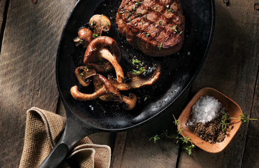 Certified Angus Beef brand steak in a cast iron skillet.