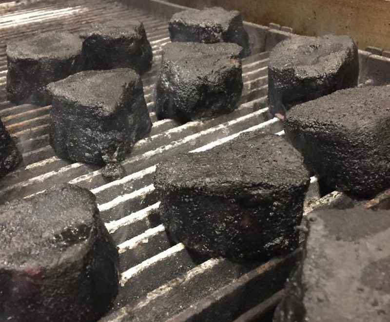 Charcoal powder adds depth to steaks.